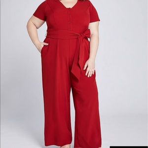 Red zip up jumpsuit.